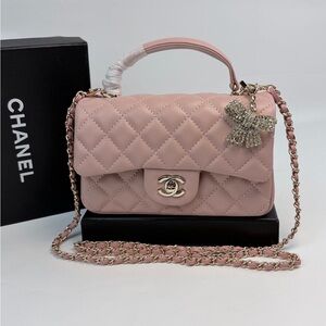 CHANEL Pink Quilted Top Handle Flap Bag with Bow Charm